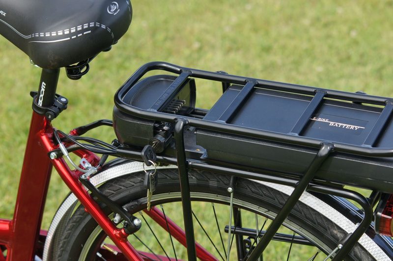 A rack-mounted e-bike battery pack, keys in the lock — an illustration of the kind of part Rankemo covers, not a specific model.